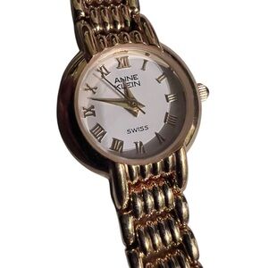 Anne Klein Gold and White Roman Numeral Bracelet Watch needs battery